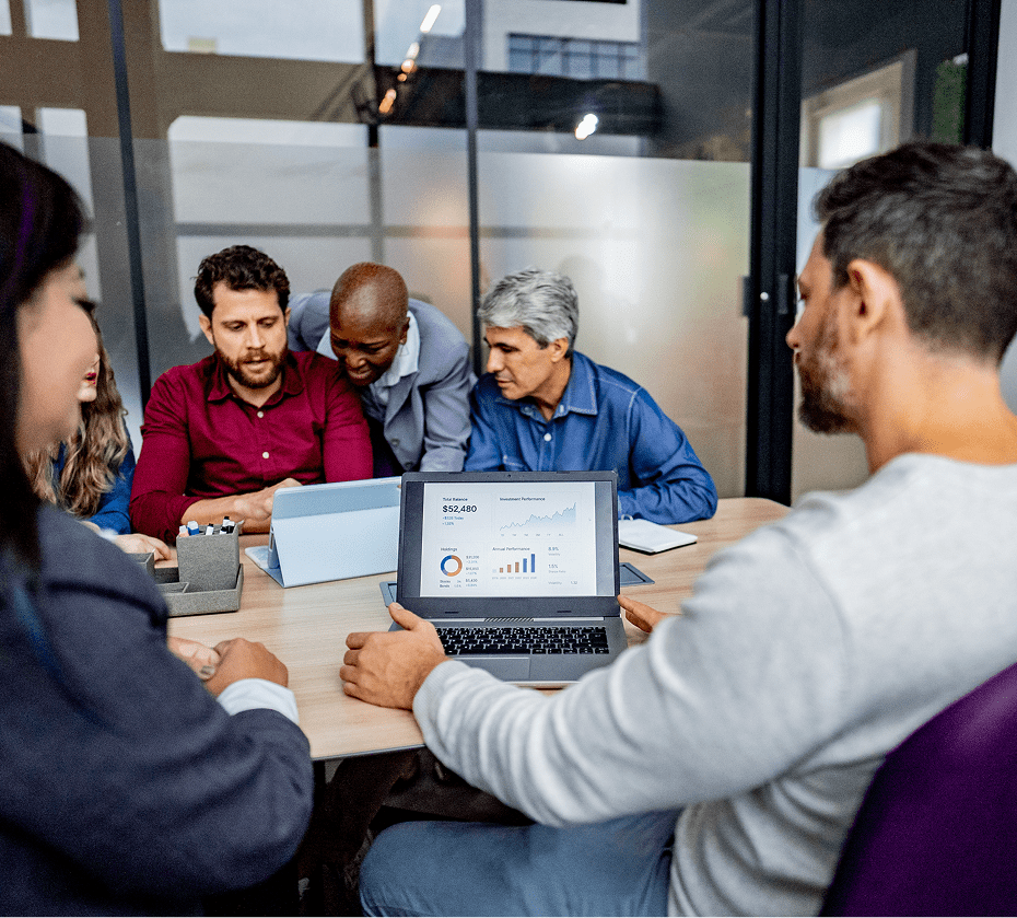 Team collaborating around a conference table.