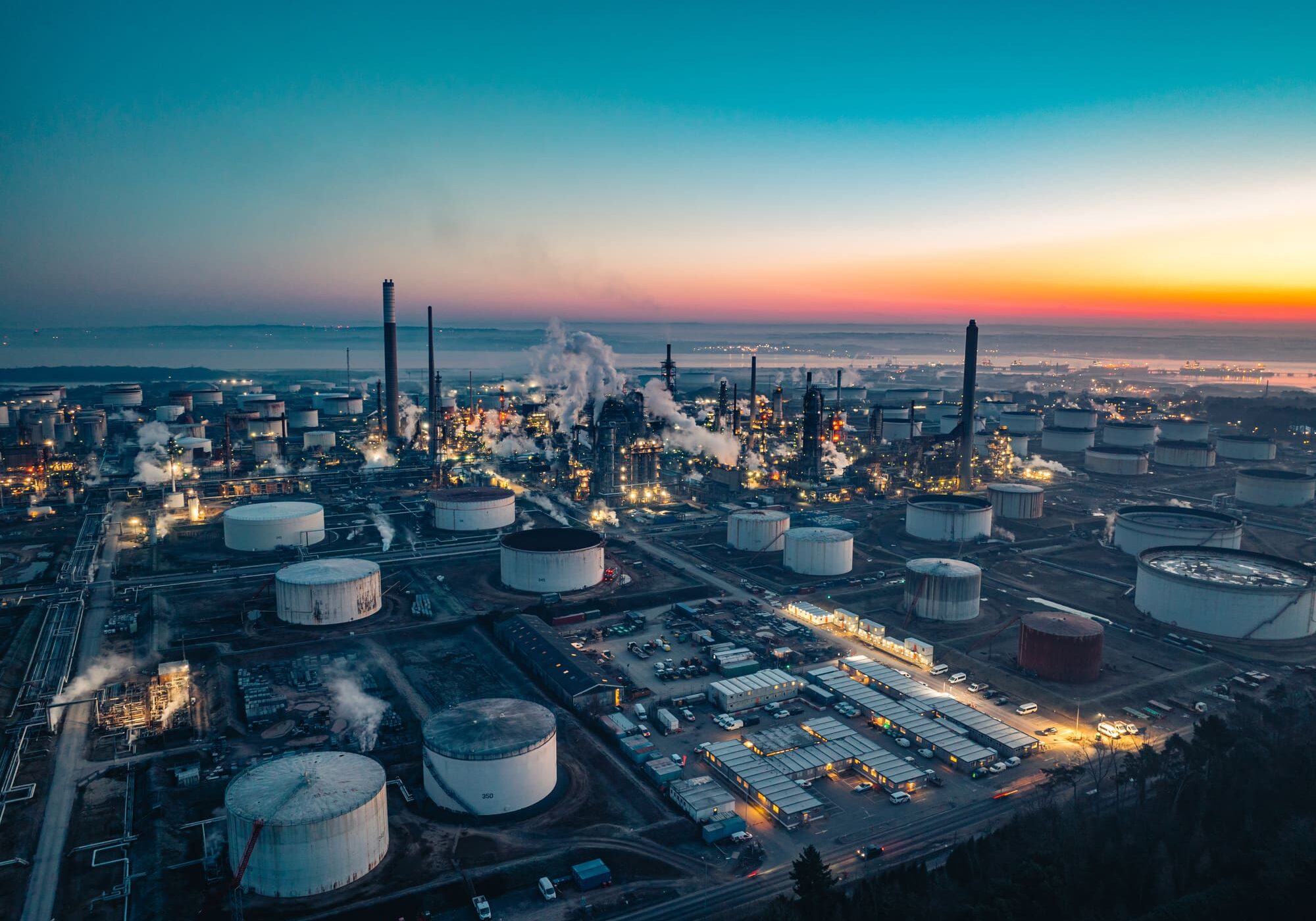 Oil refinery at twilight an aerial view of industrial power and energy production